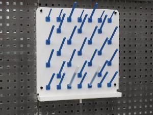 Dish rack on hole grid wall