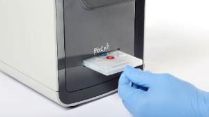 CBC test kit with internal blood and regents inserted into HemoScreen analyzer