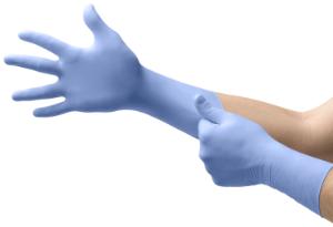 Nitrile exam glove with textured fingertips and extended cuff